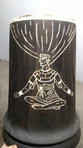 Carved figure on the side of the drum